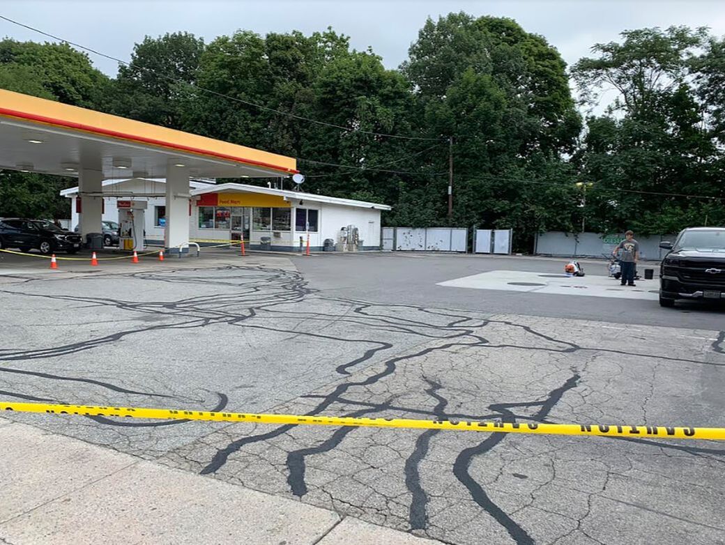 Gas station lot with cracks filled