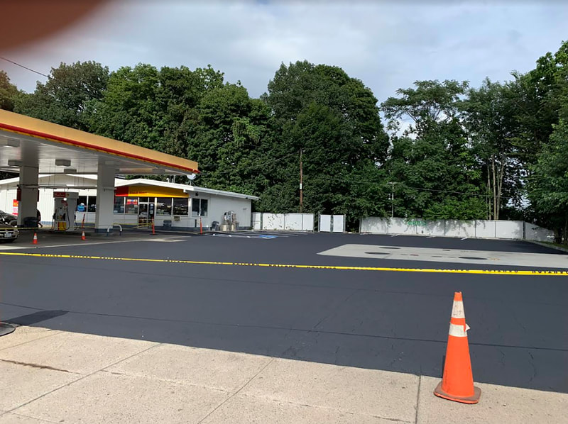 Fresh seal coat on gas station lot